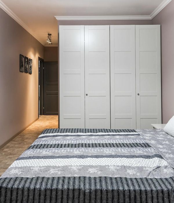 Minimalist bedroom with organized closet system